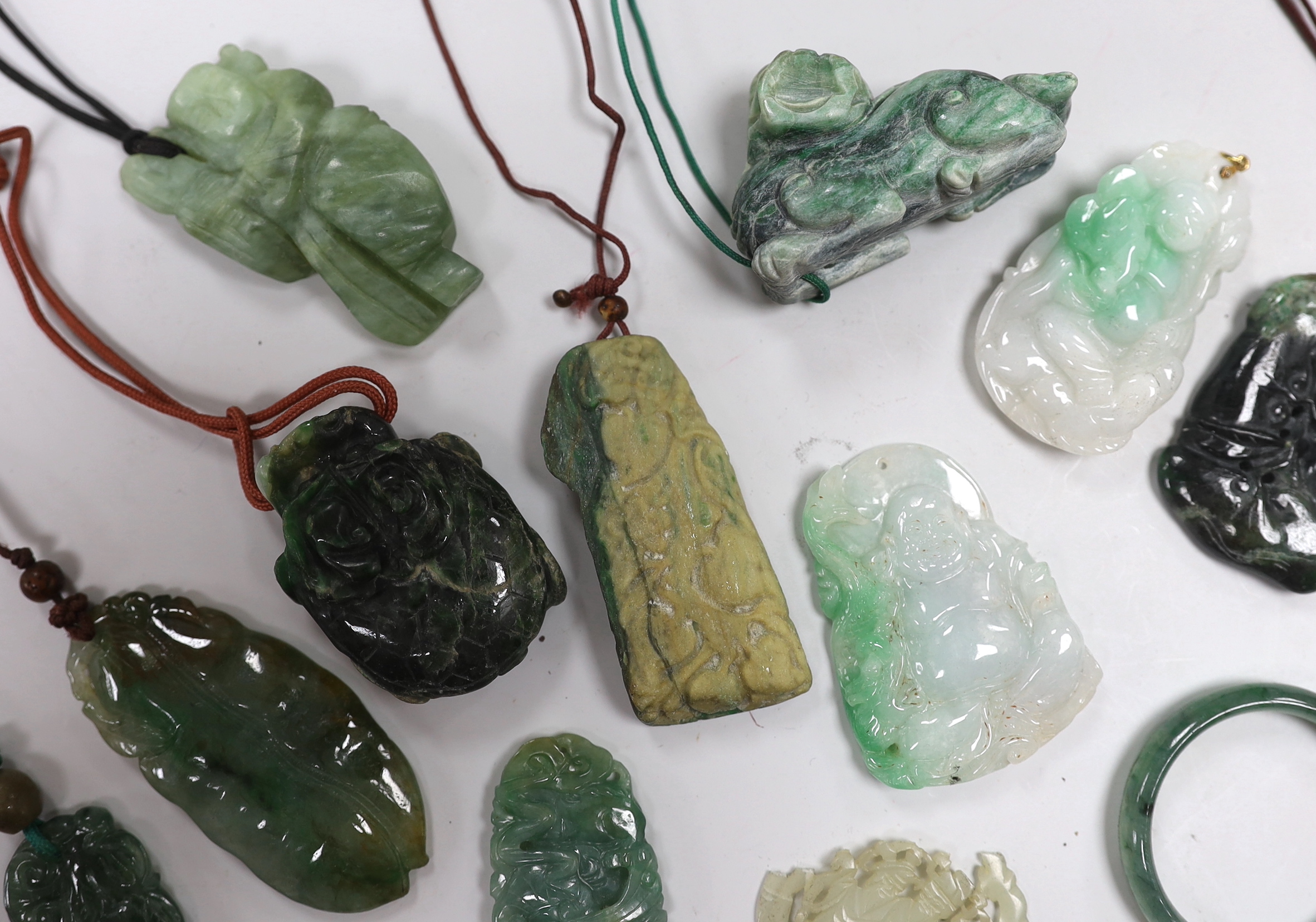 Thirteen Chinese jadeite and jade carvings, longest 6.4cm